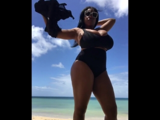 maserati xxx in a black swimsuit on the beach huge tits huge ass natural tits milf